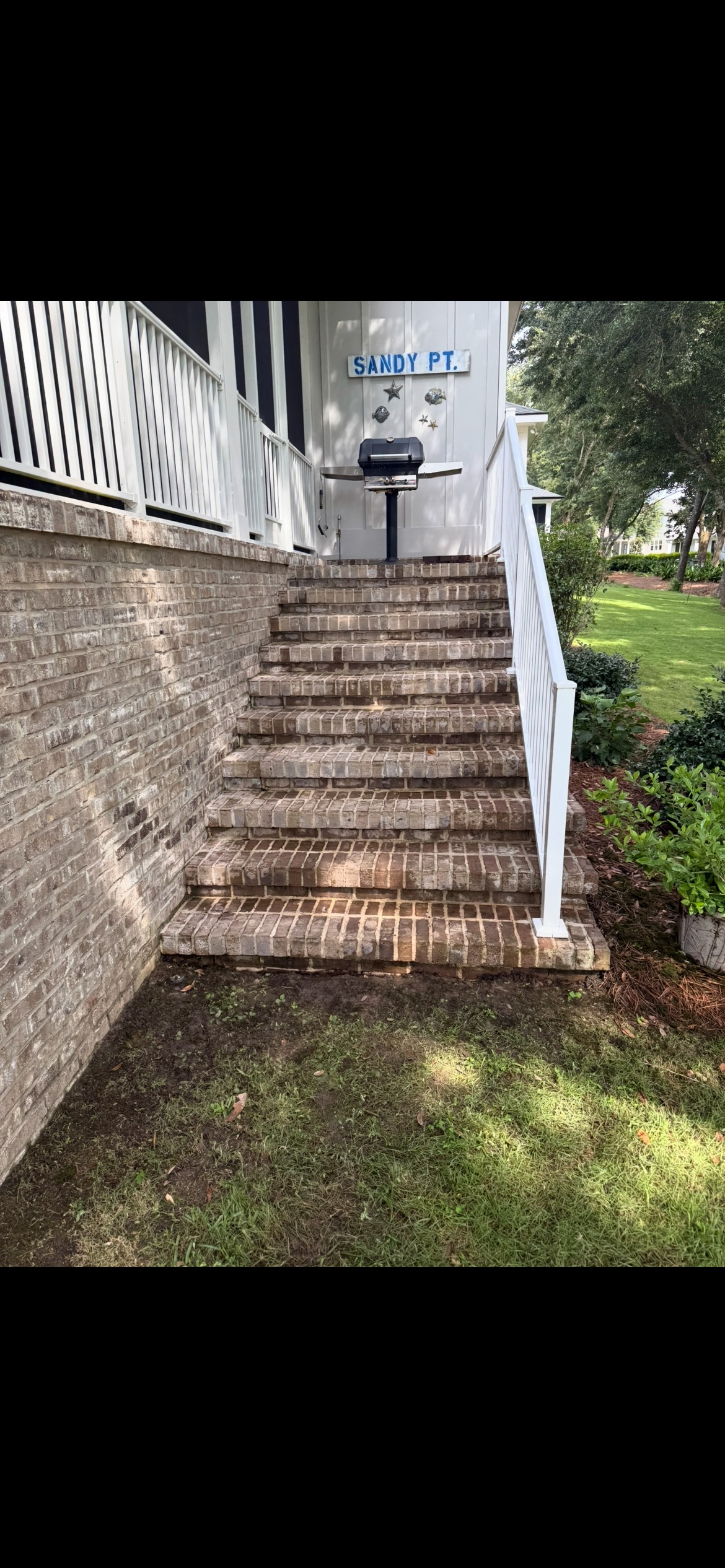 After algae removal on an exterior surface in Pensacola