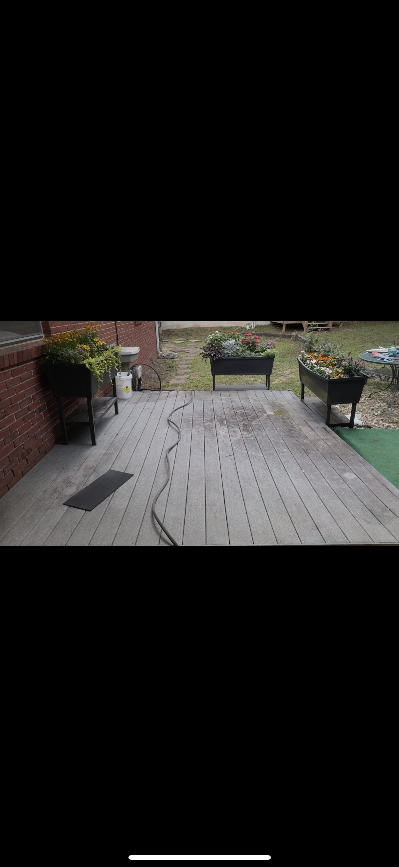 Before pressure washing of a dirty patio in Pensacola