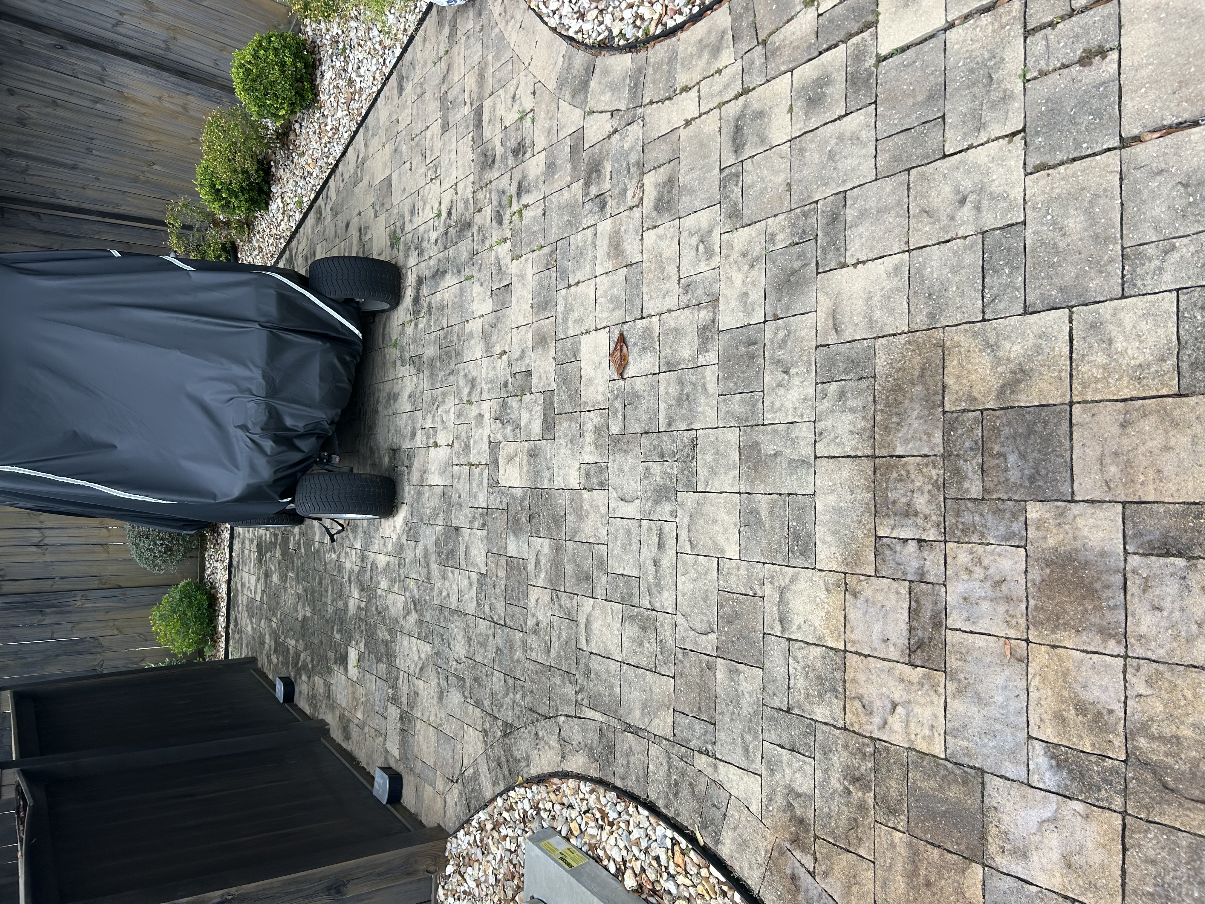 Before paver cleaning on stained pavers in Pensacola