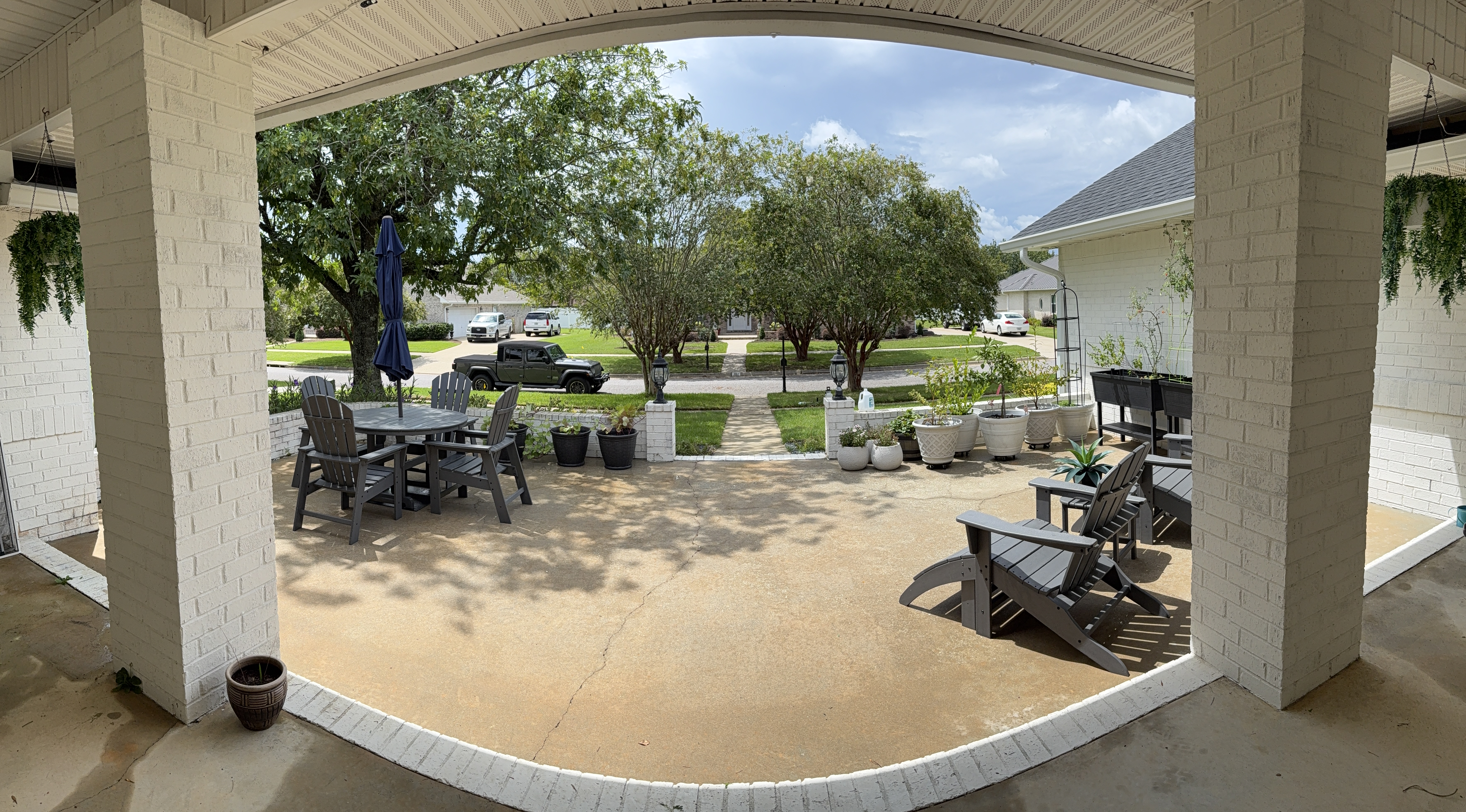 Clean concrete courtyard and seating area after pressure washing