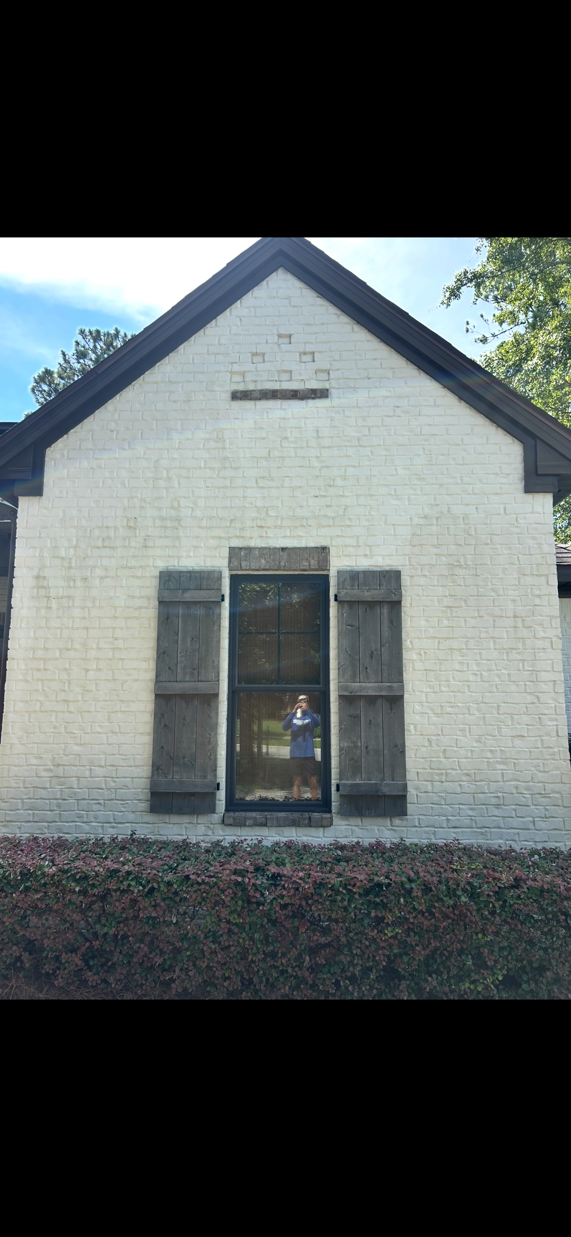 After soft washing of a cleaned house exterior in Pensacola