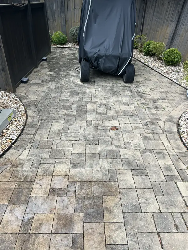 Before paver cleaning on stained pavers in Pensacola