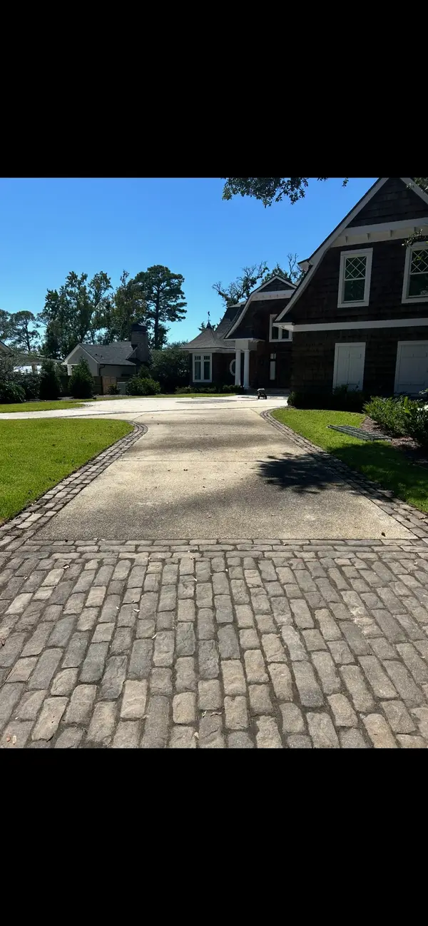 Before exterior cleaning of a dirty driveway in Gulf Breeze