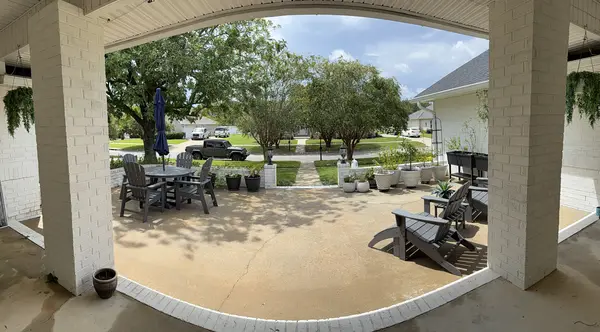 Wide view of the front courtyard and seating area after pressure washing