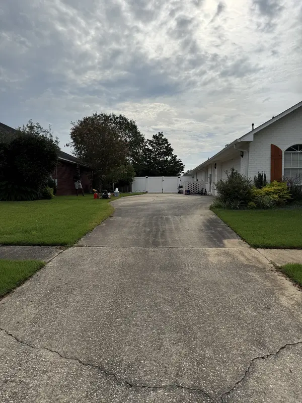 Residential concrete driveway before pressure washing