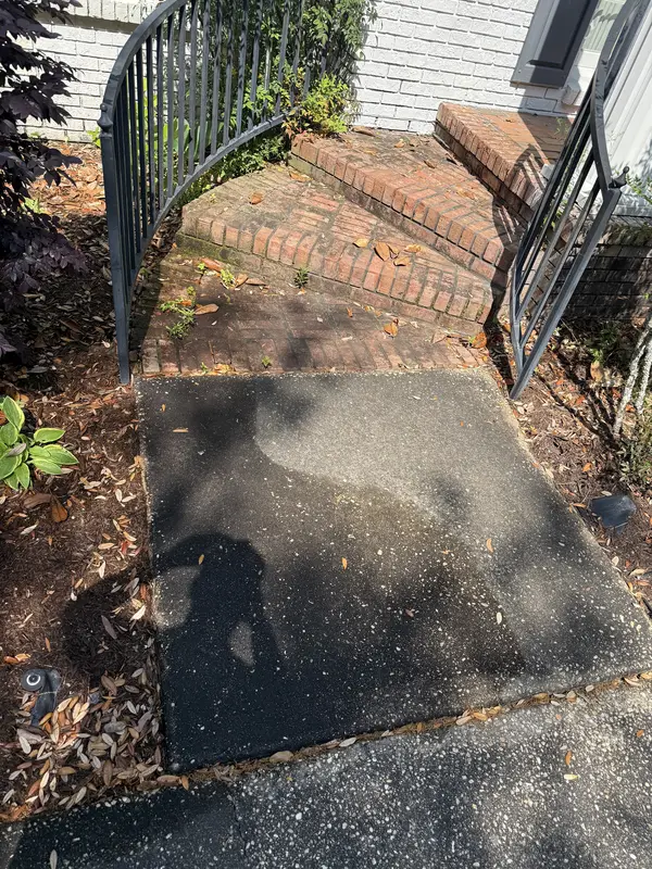 Before pressure washing of dirty outdoor stairs in Pensacola