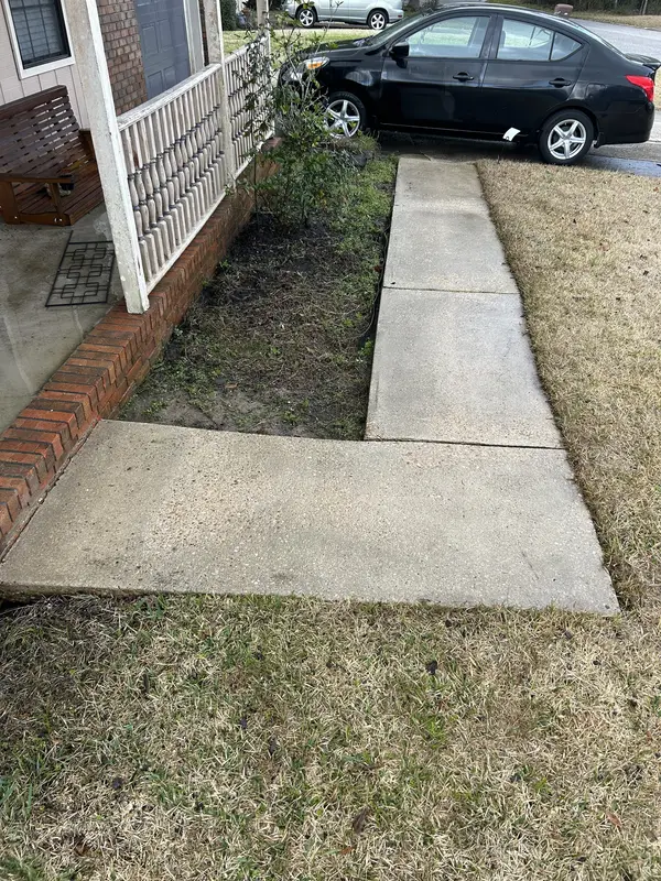 After walkway pressure washing with a brighter surface in Pensacola
