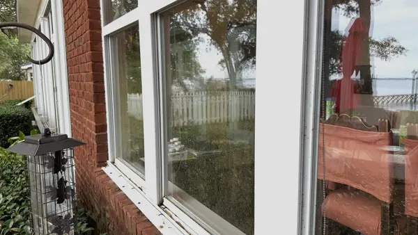 Before window cleaning with visible film and buildup on waterfront glass