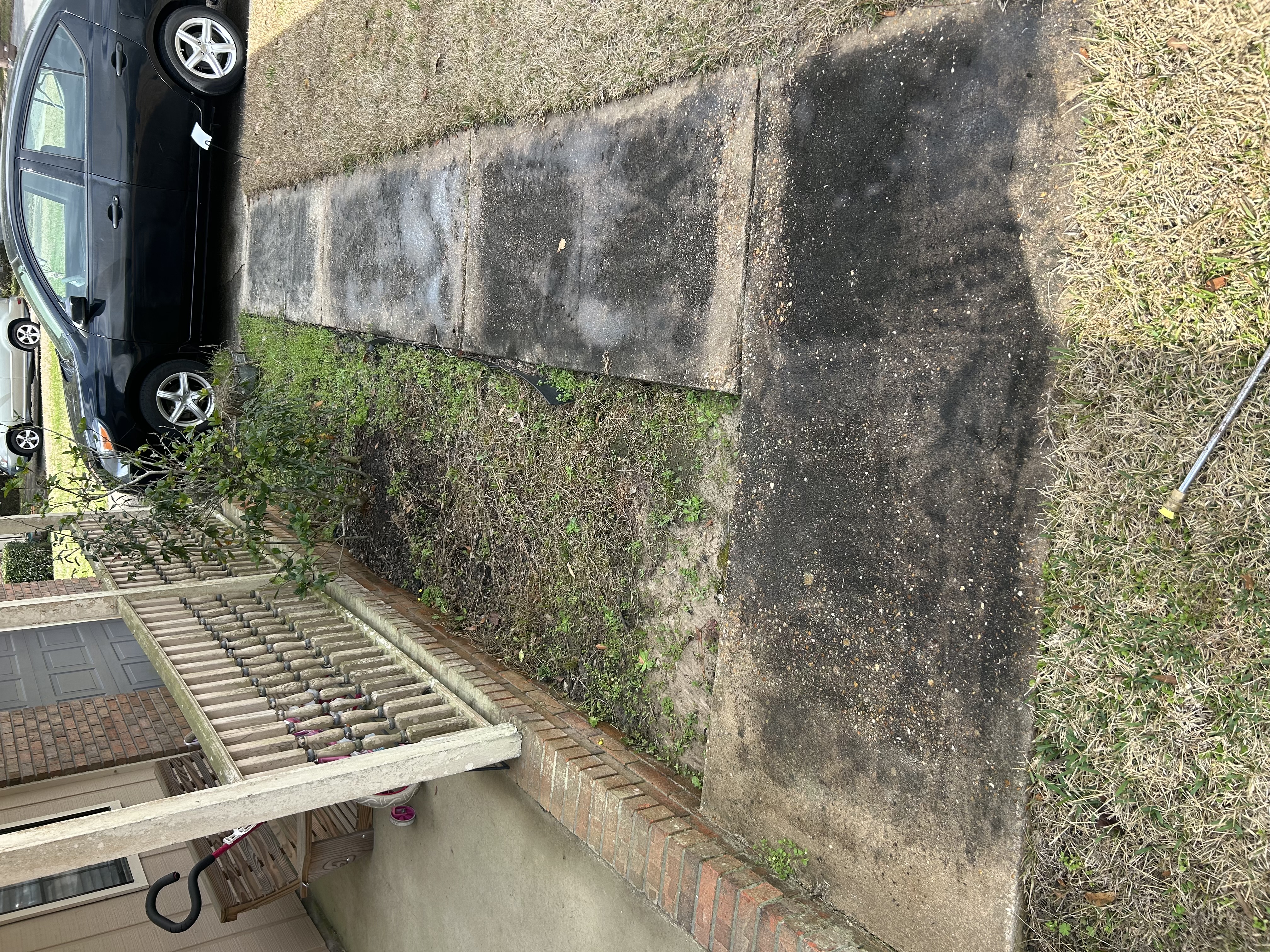 Before walkway cleaning with surface buildup in Pensacola