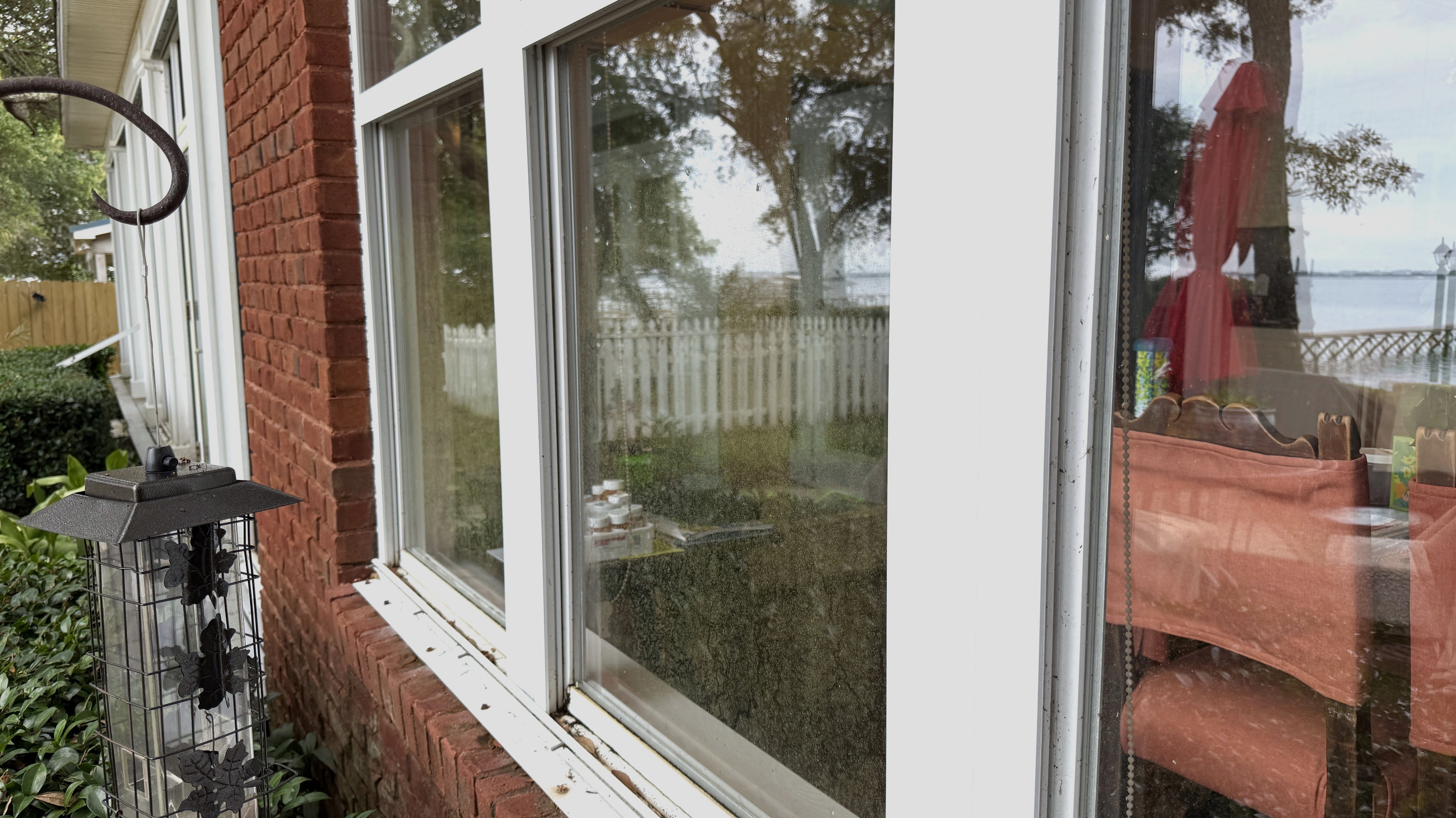 Before window cleaning with visible film and buildup on waterfront glass