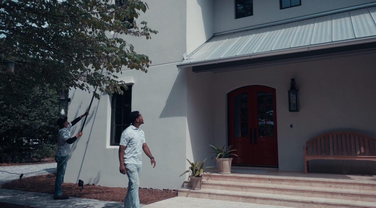 Exterior cleaning workers washing windows in Pensacola Florida